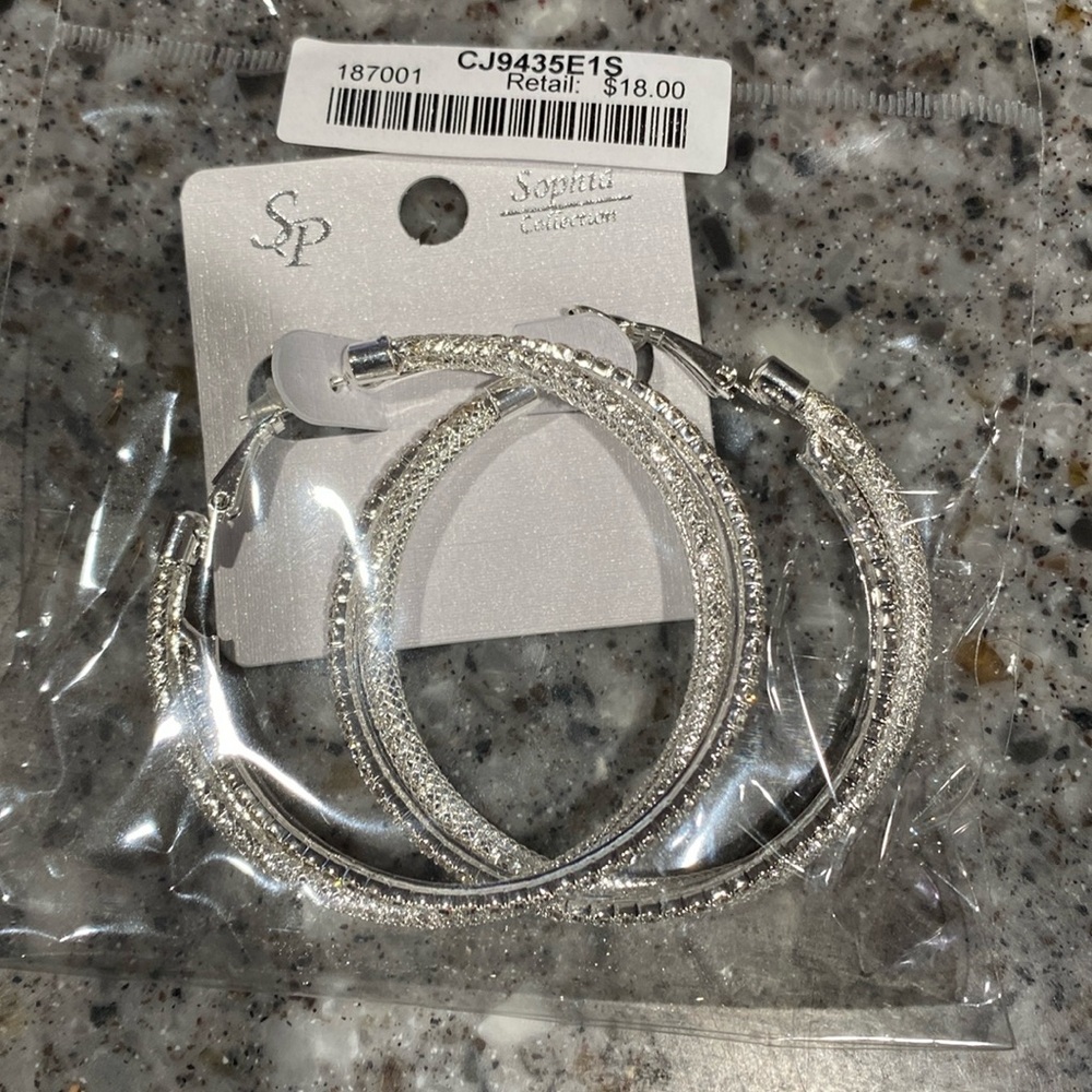 Sophia collection 2” silver tone hoop earrings.